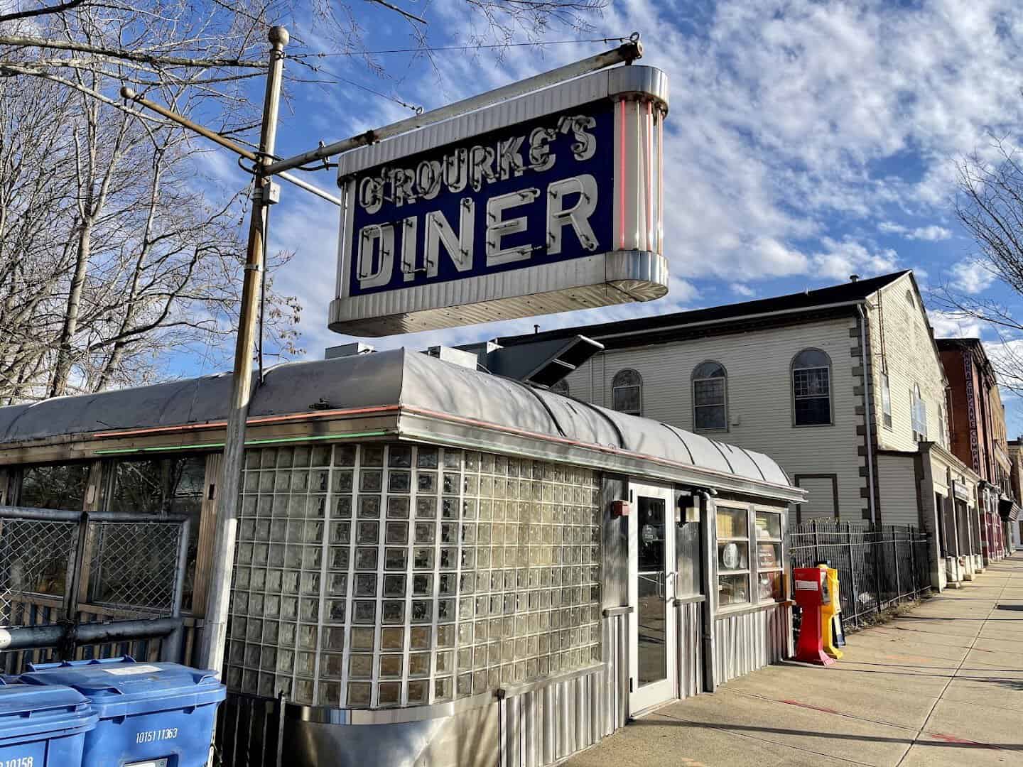Stainless steel exterior and blue neon sign of O'Rourke's Diner in Middletown, Connecticut