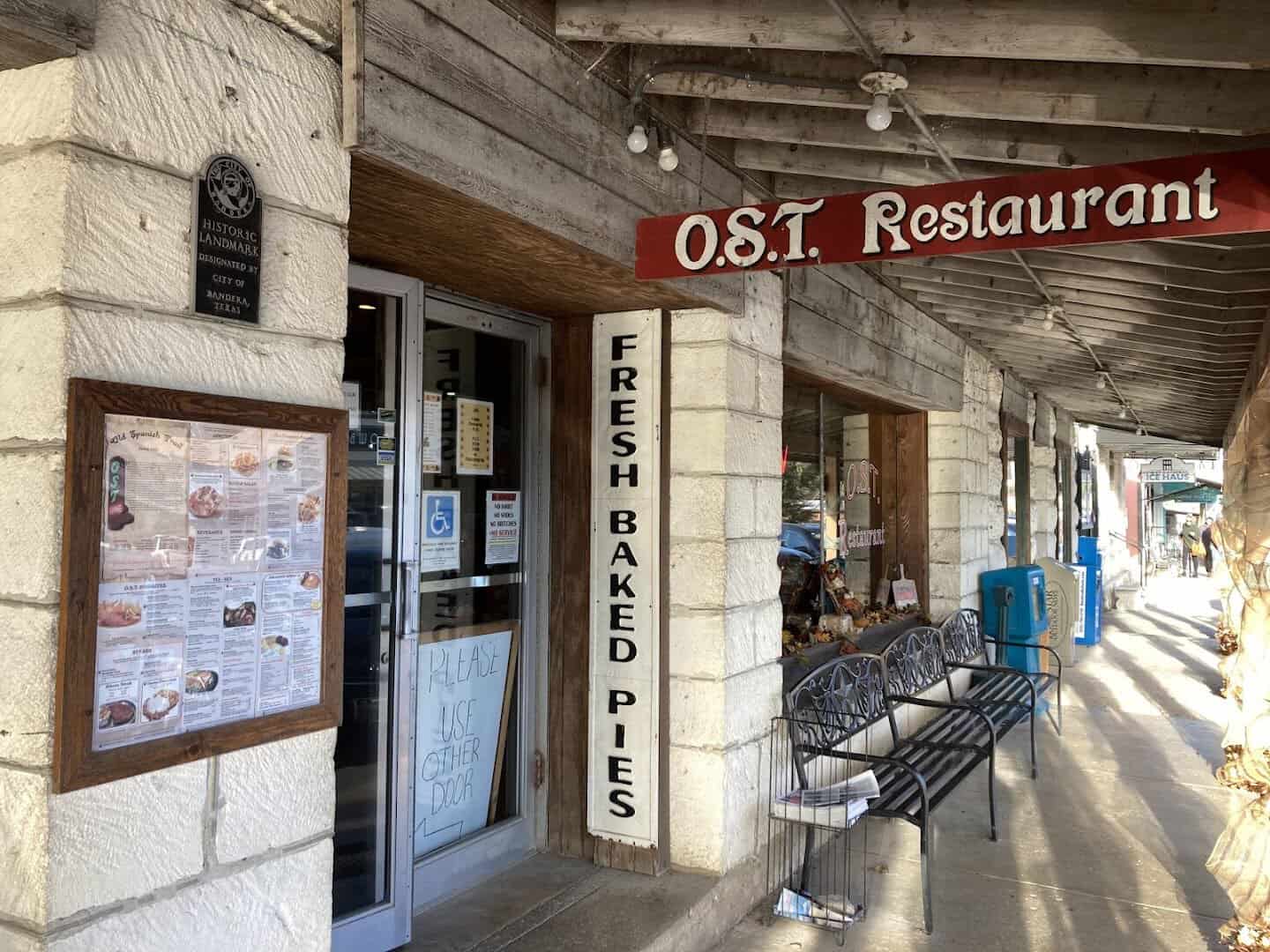 OST Restaurant storefront with a fresh baked pies sign in Bandera