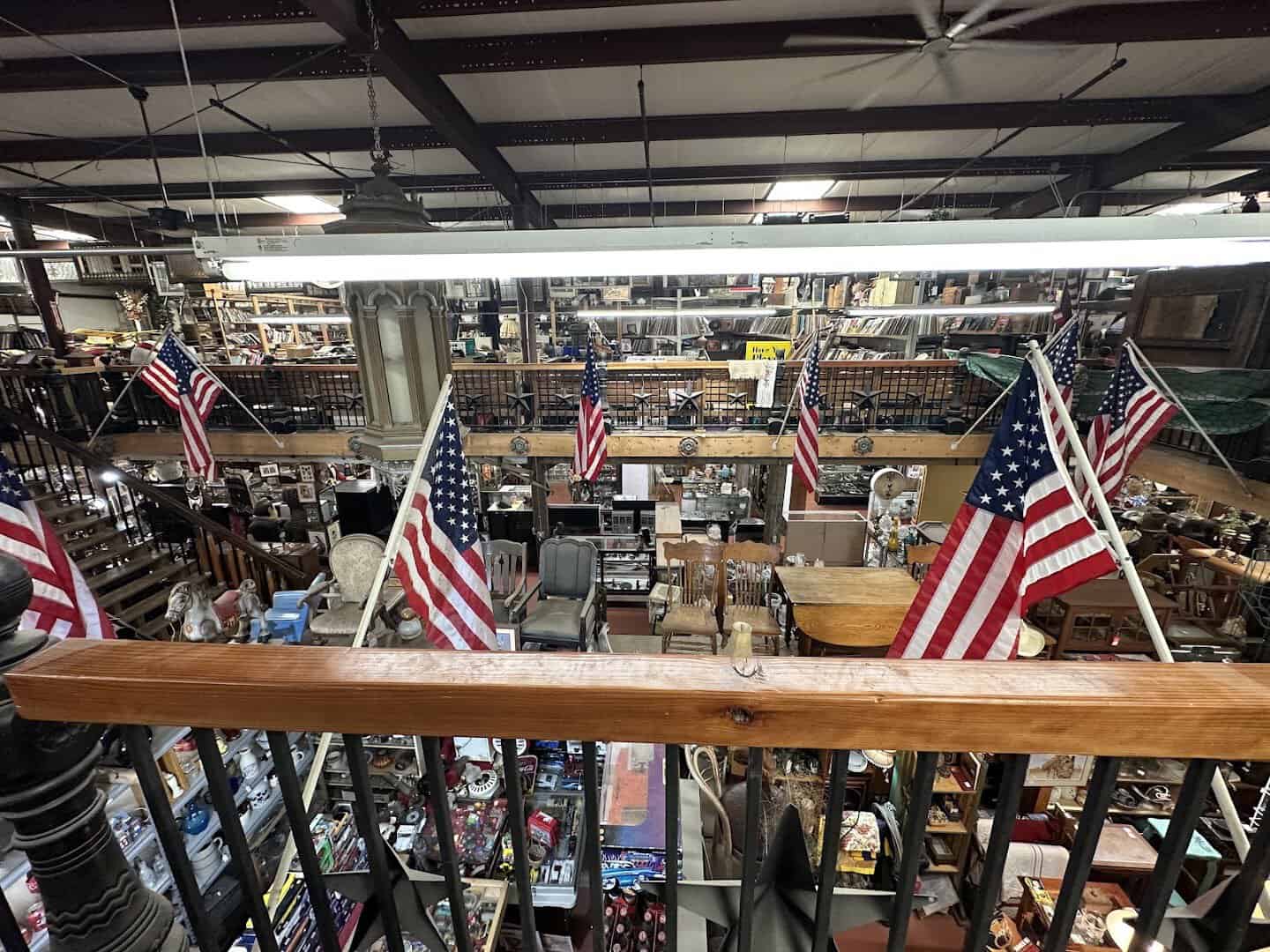 A packed counter of antiques and hanging collectibles inside The Whoopee Bowl Antique Mall in Canutillo, Texas