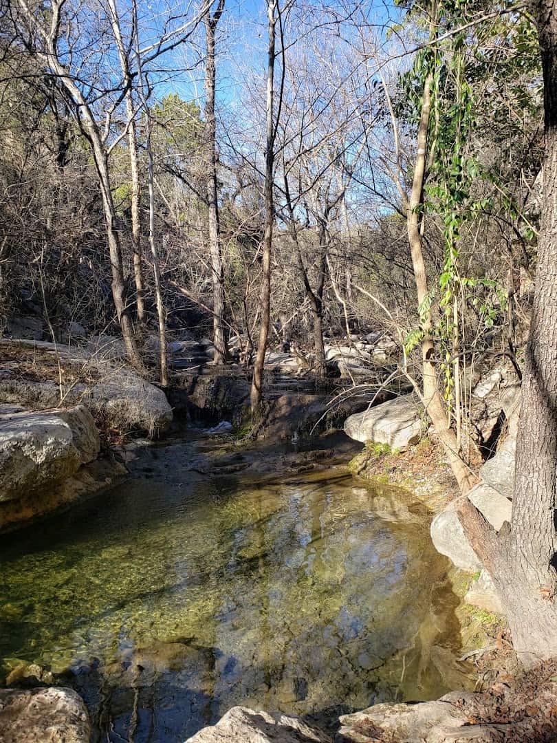 Panther Hollow Creek running over limestone rocks in the canyon at River Place Nature Trail, Austin, Texas