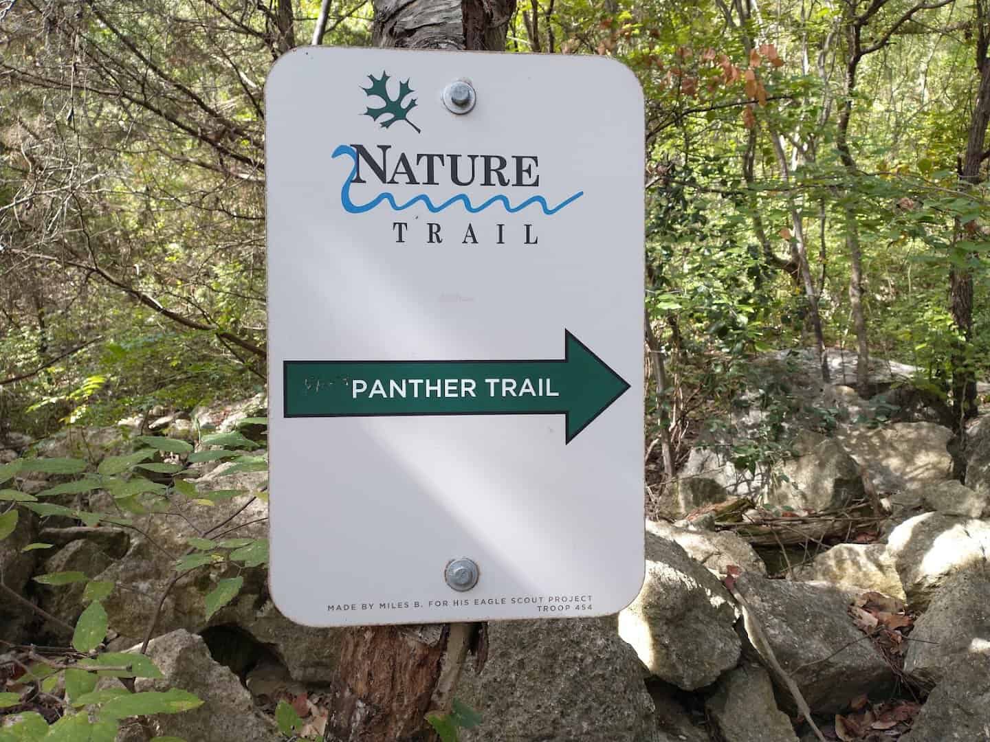 Panther Trail directional trail marker at River Place Nature Trail in Austin, Texas