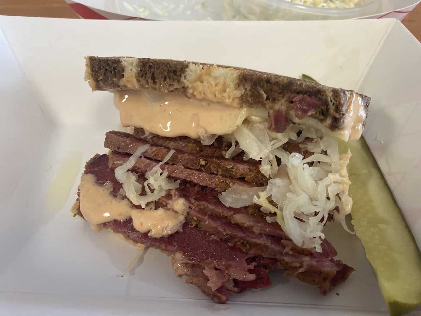 Close-up of house-made pastrami and sauerkraut on rye at Otherside Deli in Austin