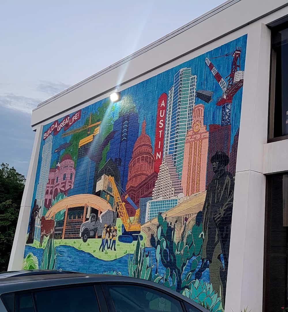Colorful Austin skyline mural on the wall outside Pavement