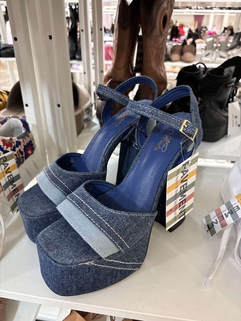 Denim platform wedge shoes on display at Pavement resale shop in Austin