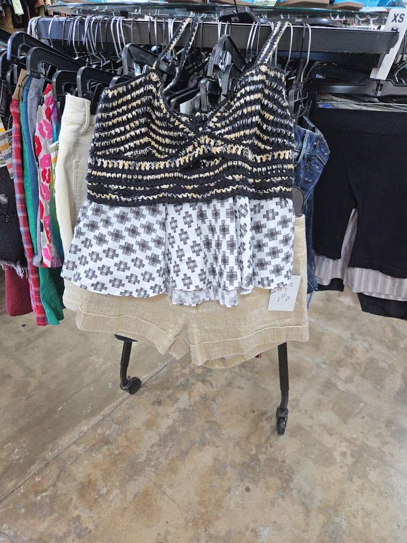 Rack of patterned tops and clothing at Pavement resale shop in Austin