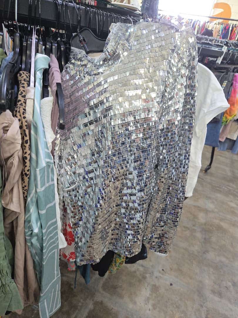 Rack of sequined and sparkly designer dresses at Pavement in Austin