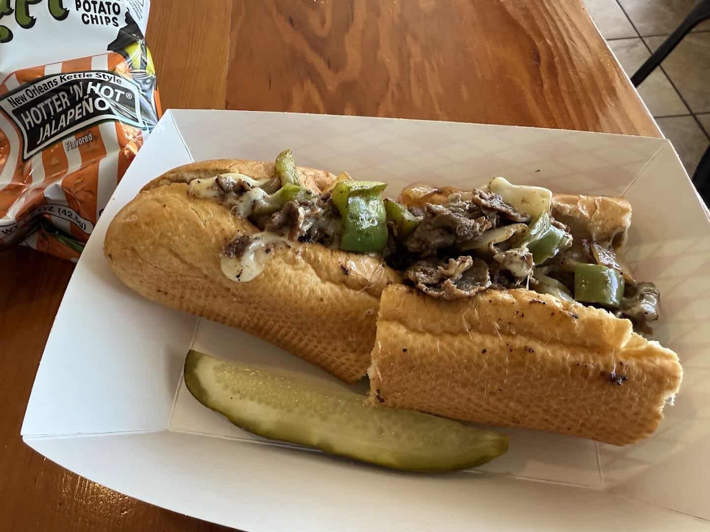 Philly cheesesteak with peppers and a pickle at Otherside Deli in Austin