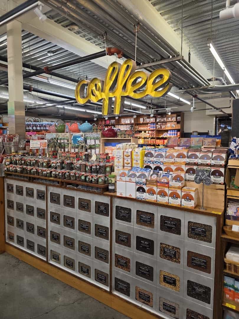 Wall of bulk spices and grains bins at Phoenicia Specialty Foods in Houston