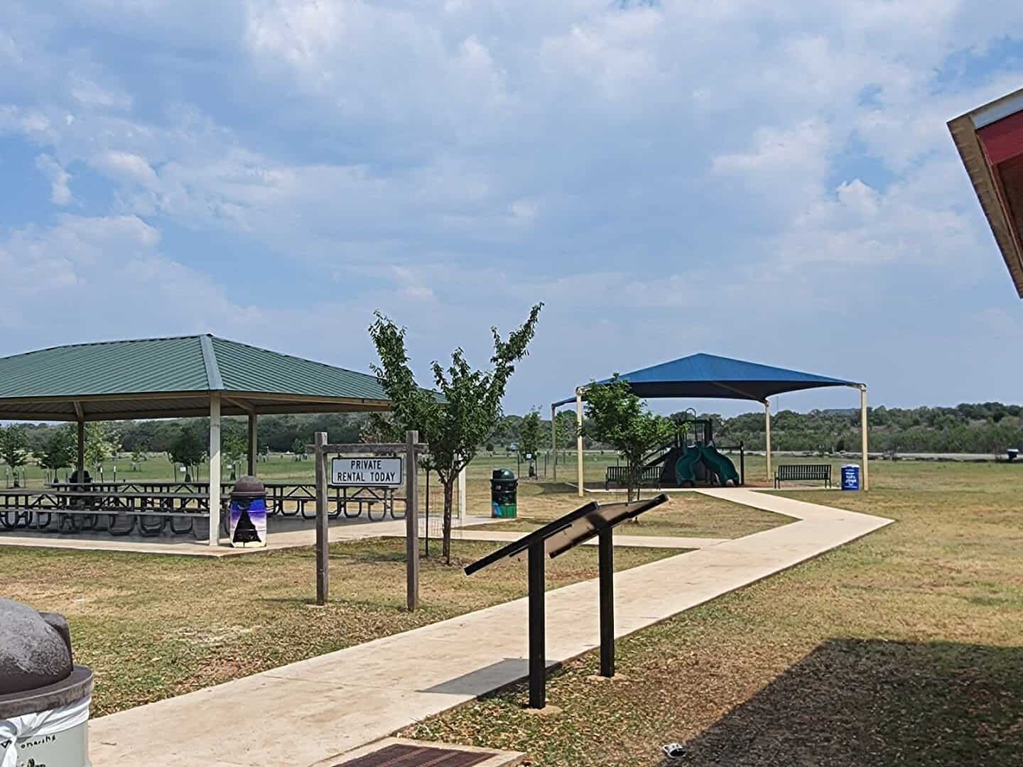 Covered picnic pavilion and shade structures at Boerne City Lake Park in Boerne, Texas