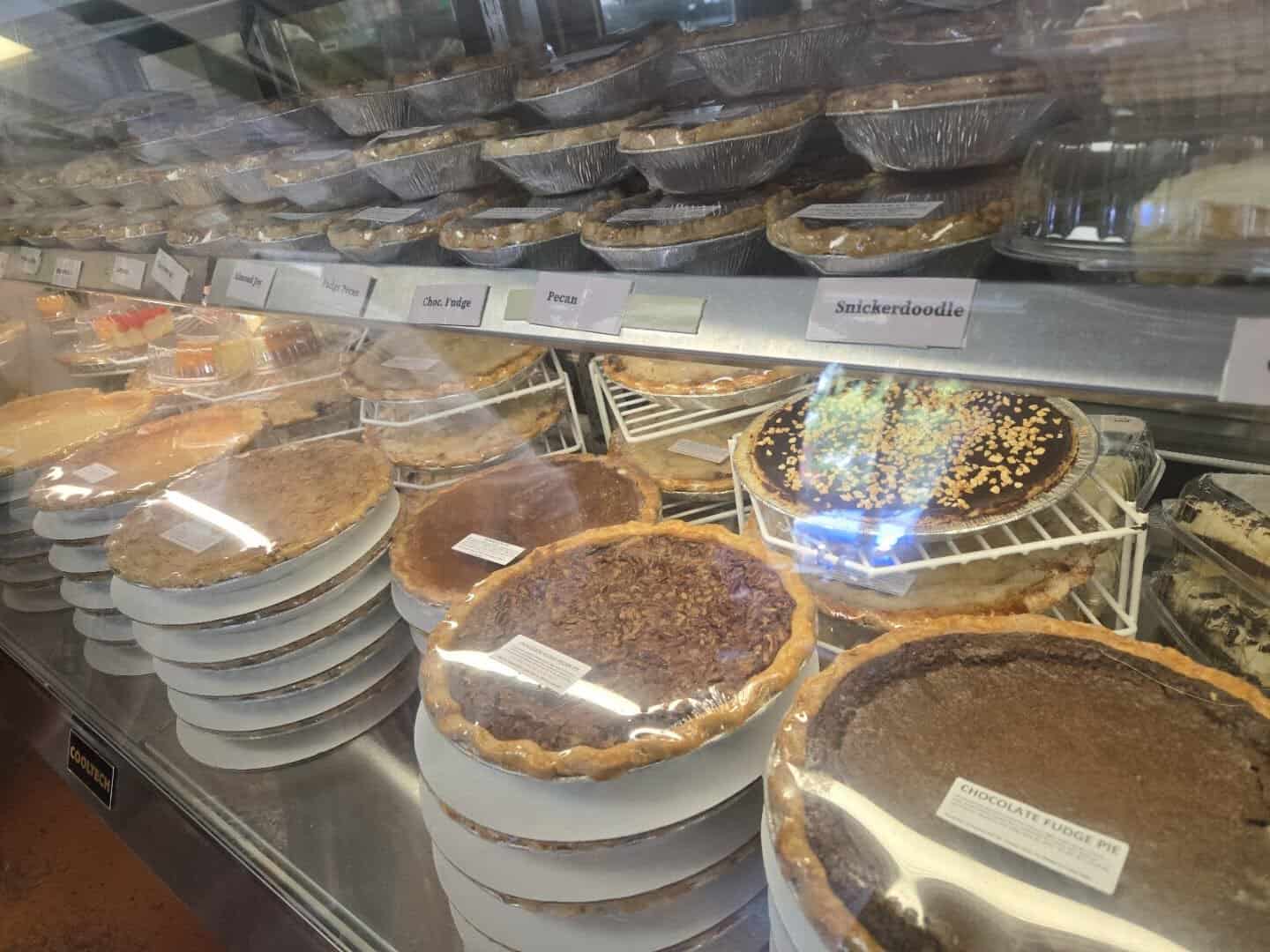 Pie case with flavor labels for snickerdoodle and chocolate fudge at Texas Pie Company in Kyle, Texas