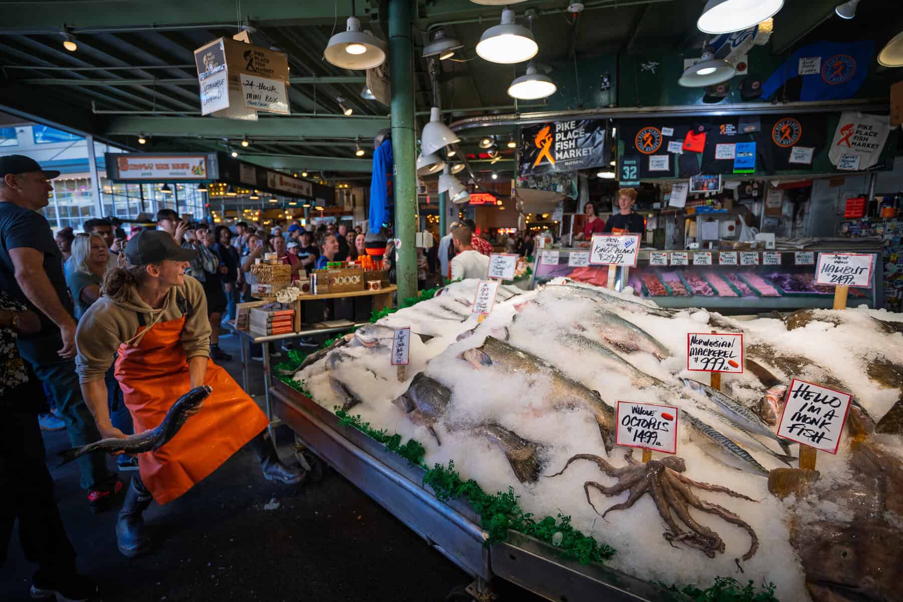 Produce and seafood stalls at Pike Place Market in Seattle, Washington
