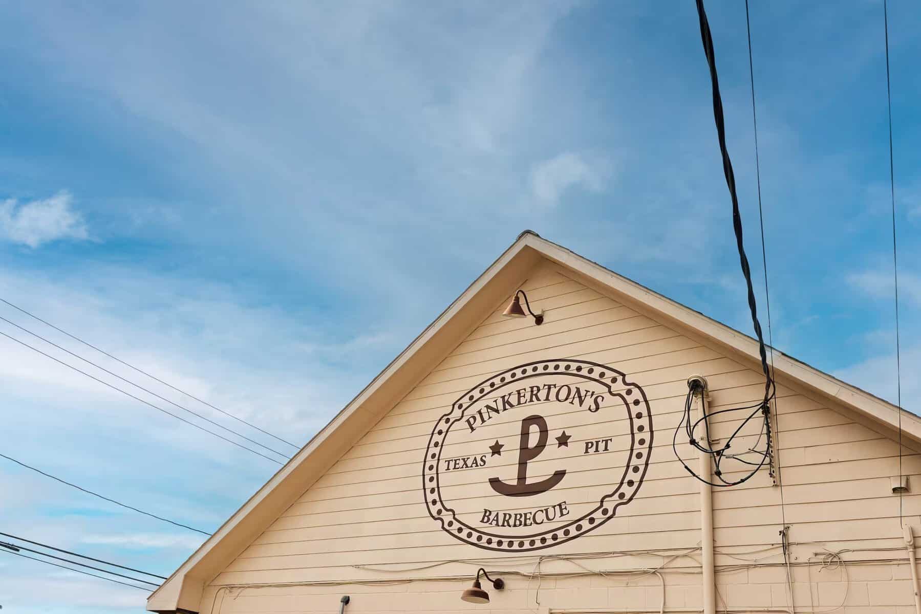 Pinkerton's Barbecue storefront gable with logo in Houston