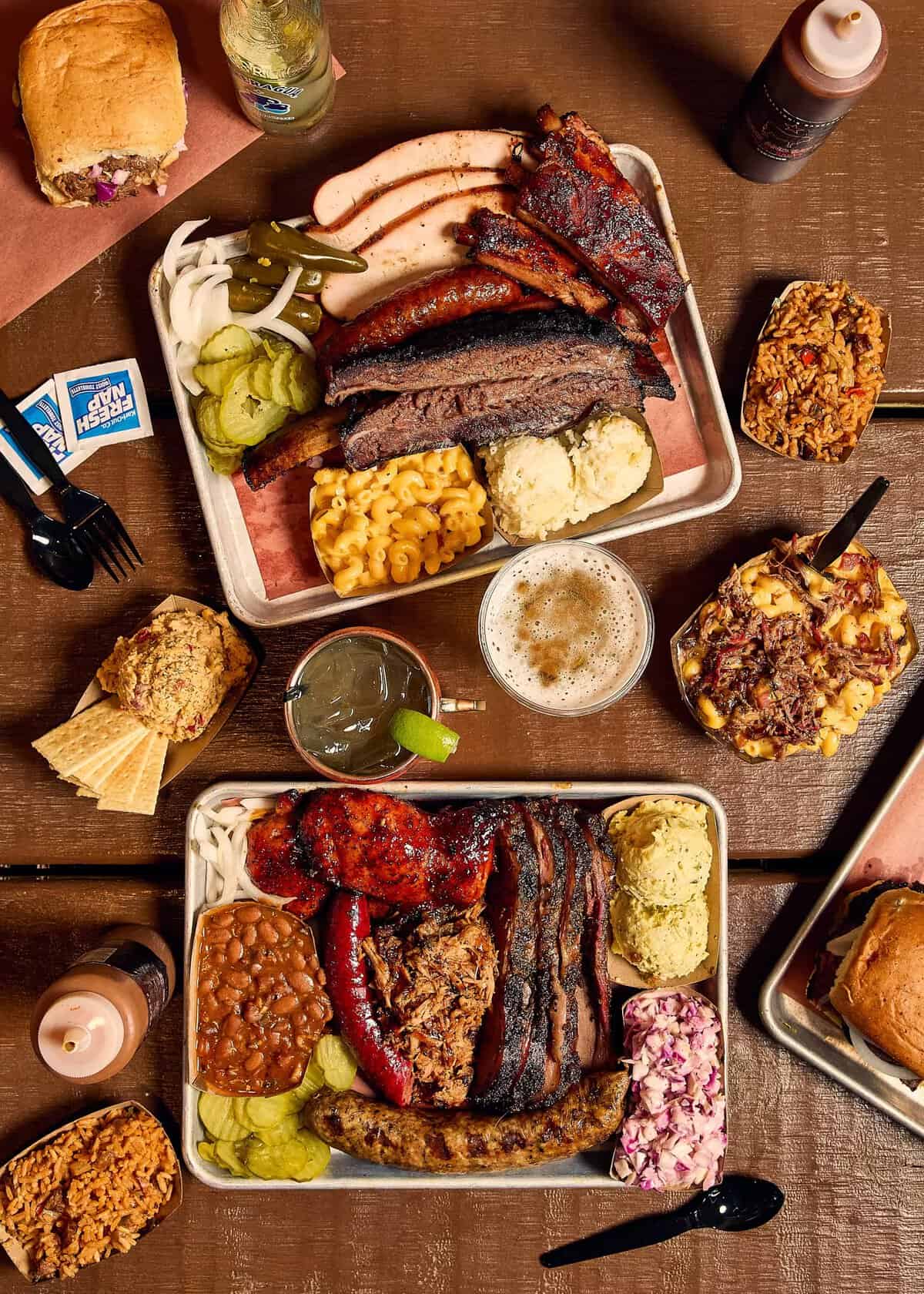 Overhead spread of brisket, ribs, sausage and sides at Pinkerton's Barbecue