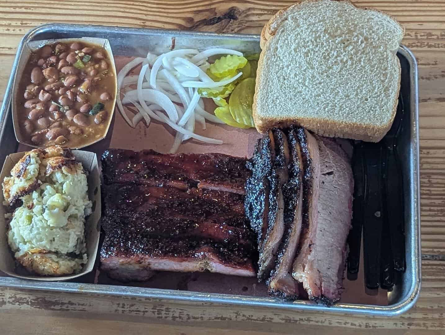 Sliced brisket and pork ribs tray at Pinkerton's Barbecue in Houston