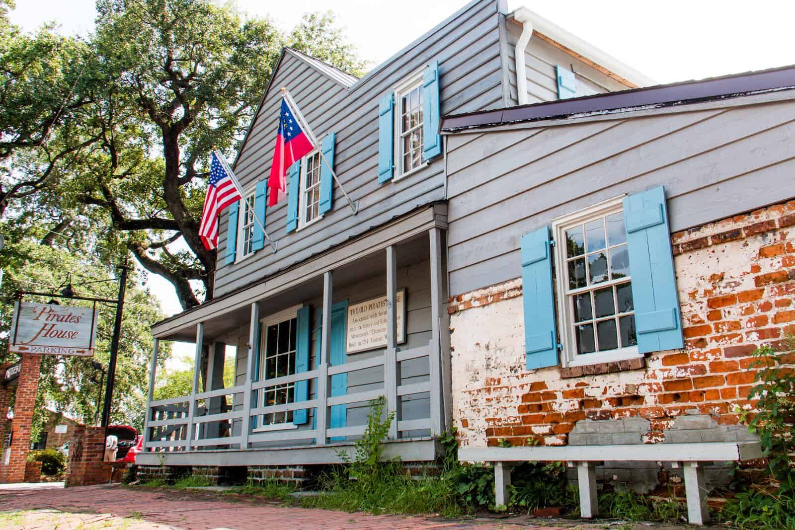 Historic clapboard exterior and sign at The Pirates' House in Savannah, Georgia