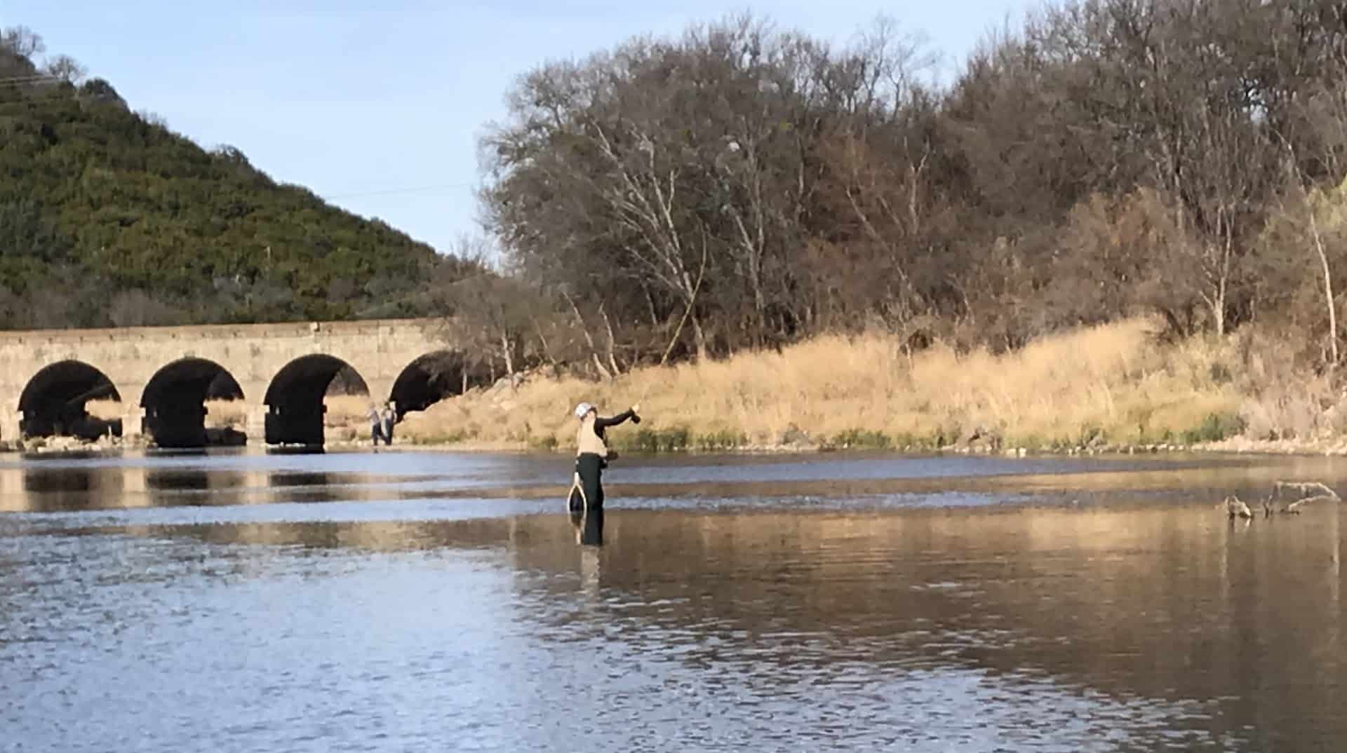 Anglers fishing the Brazos River below the Possum Kingdom Stone Arch Bridge near Graford, Texas
