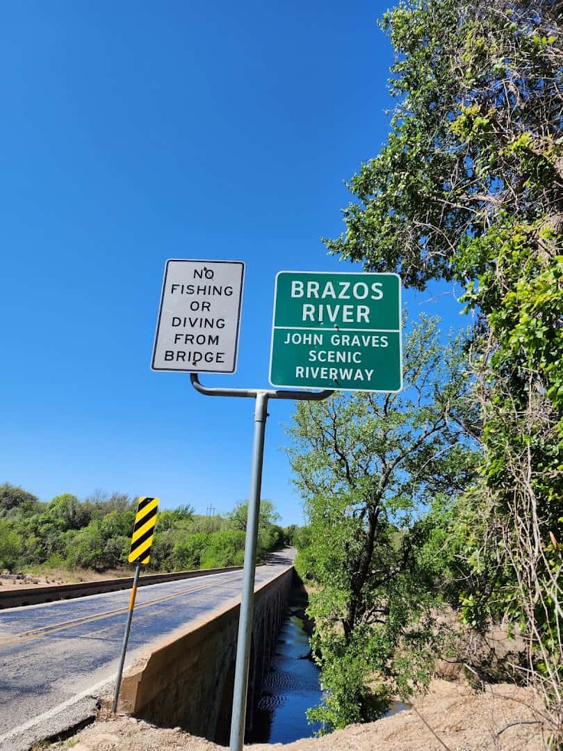 Brazos River sign at the end of the Possum Kingdom Stone Arch Bridge on State Highway 16