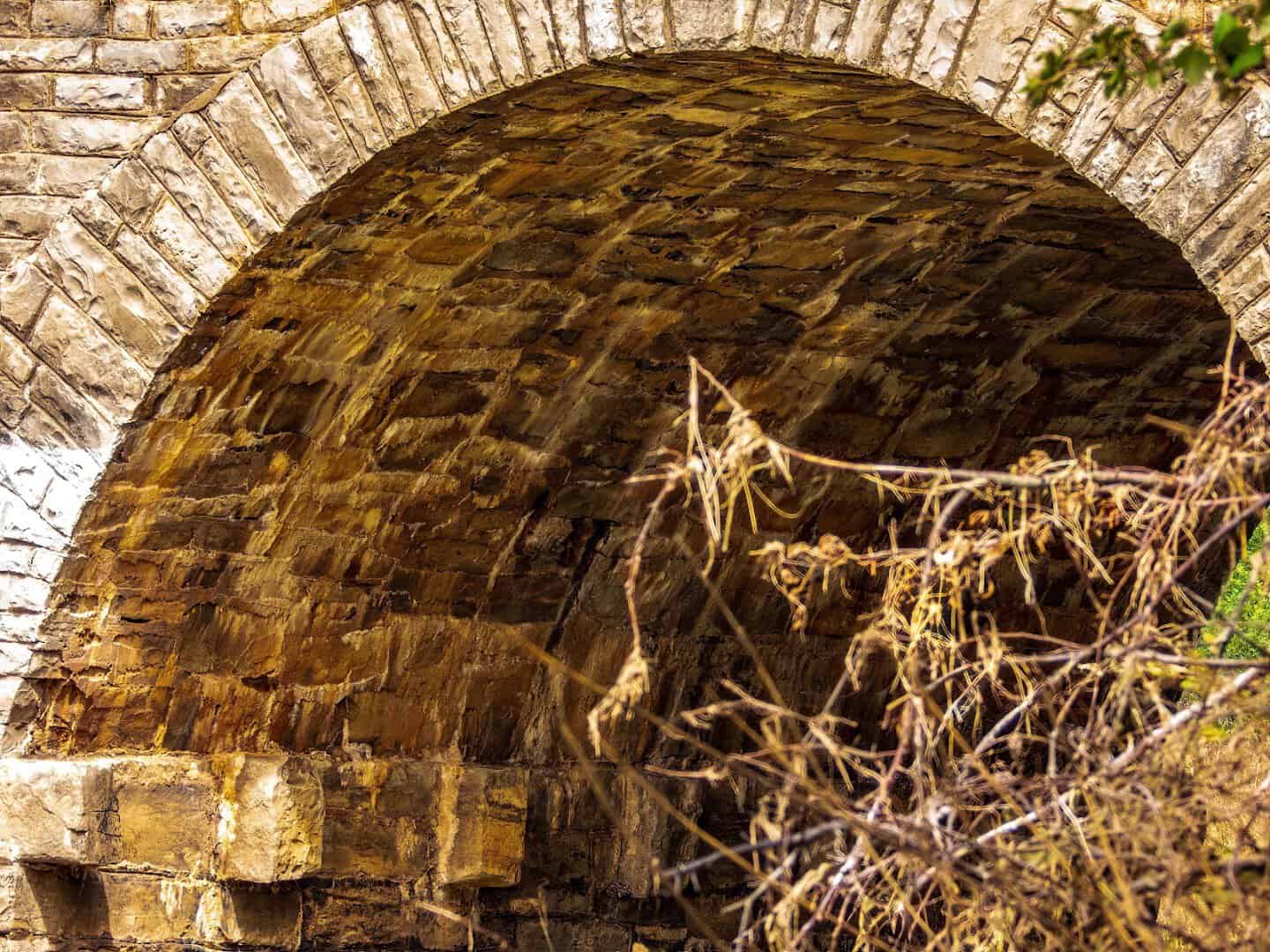 Detail of the cut limestone masonry inside an arch of the Possum Kingdom Stone Arch Bridge