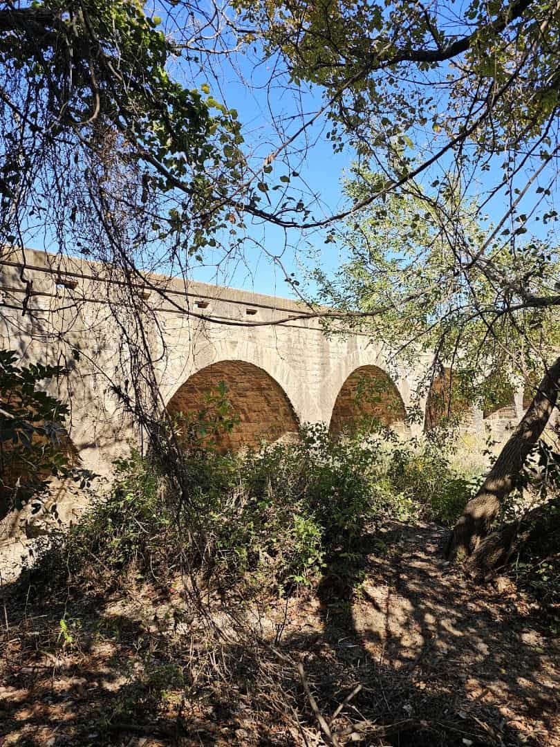 Side view of the eighteen limestone arches of the Possum Kingdom Stone Arch Bridge in Palo Pinto County, Texas