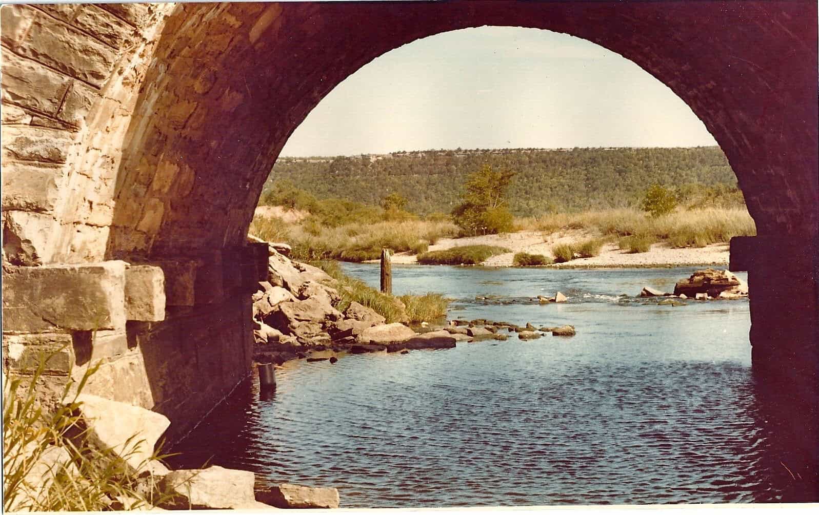 View through one of the stone arches of the Possum Kingdom Stone Arch Bridge to the Brazos River