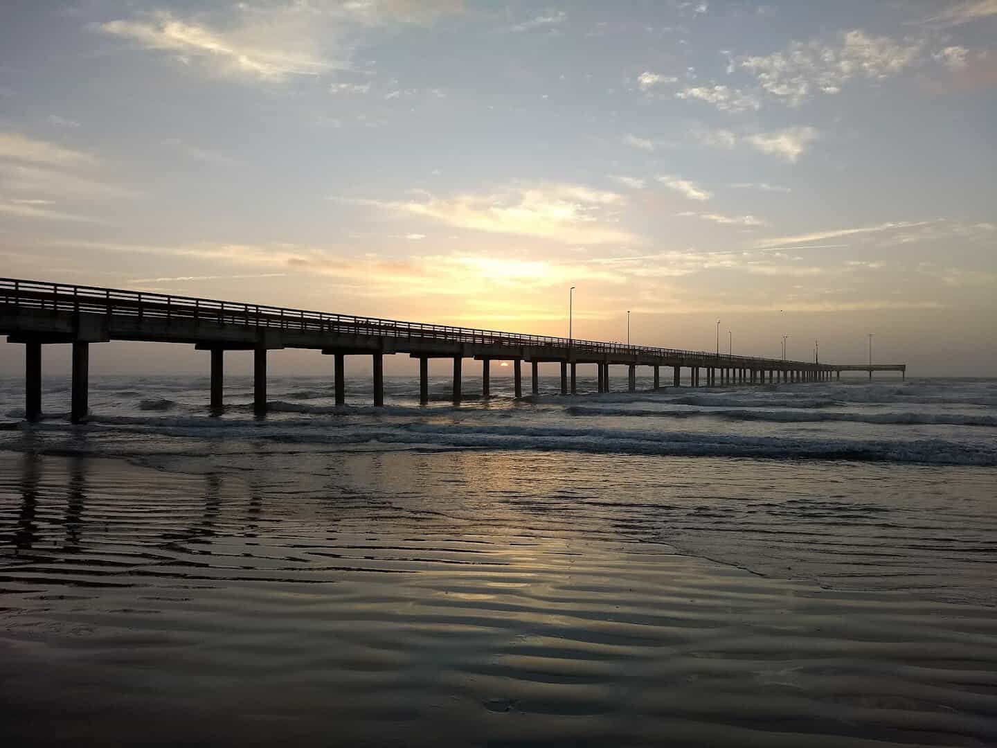 Horace Caldwell Pier over the Gulf at golden hour in Port Aransas, Texas