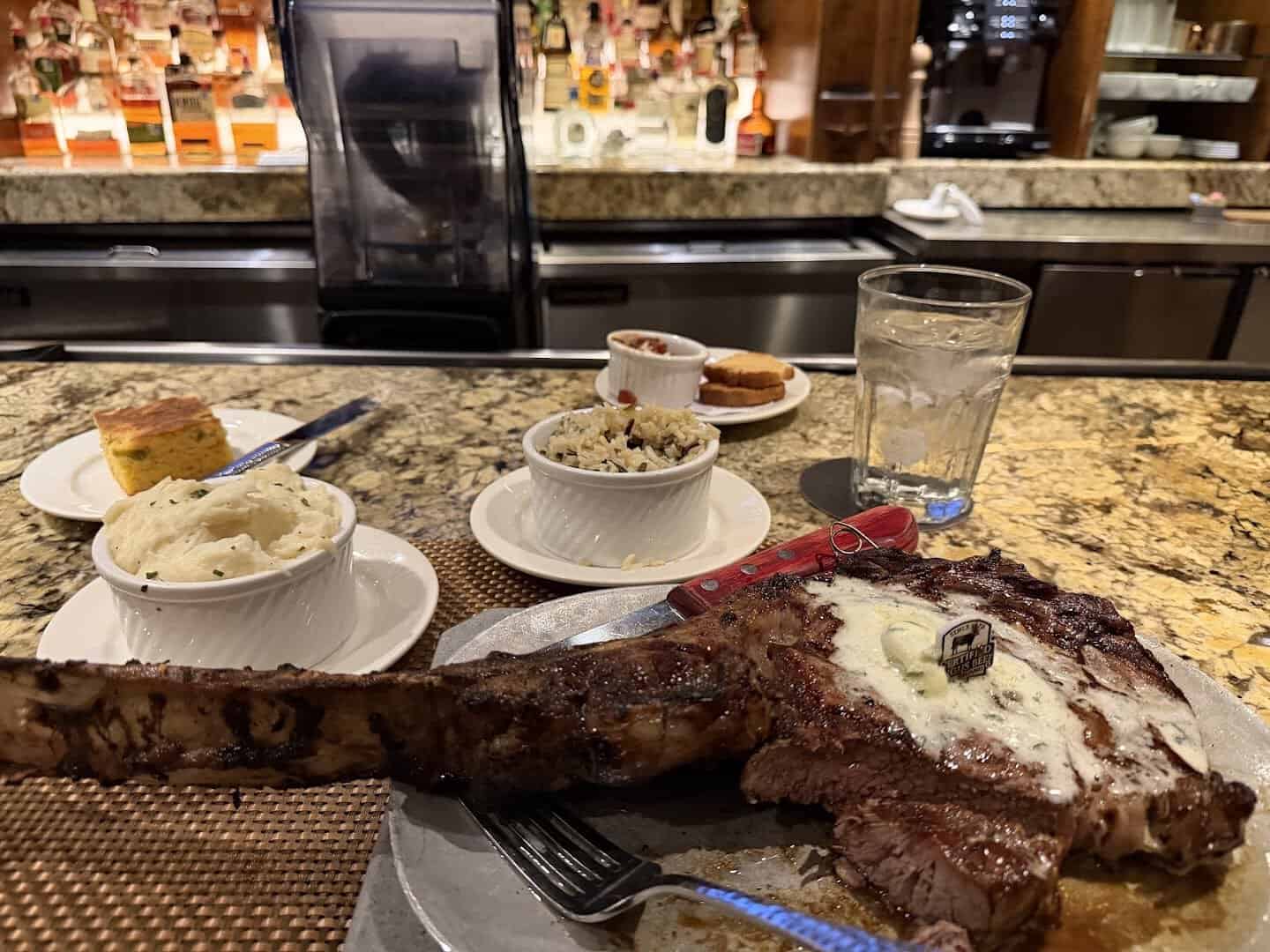 Bone-in porterhouse steak on the table at Taste of Texas in Houston