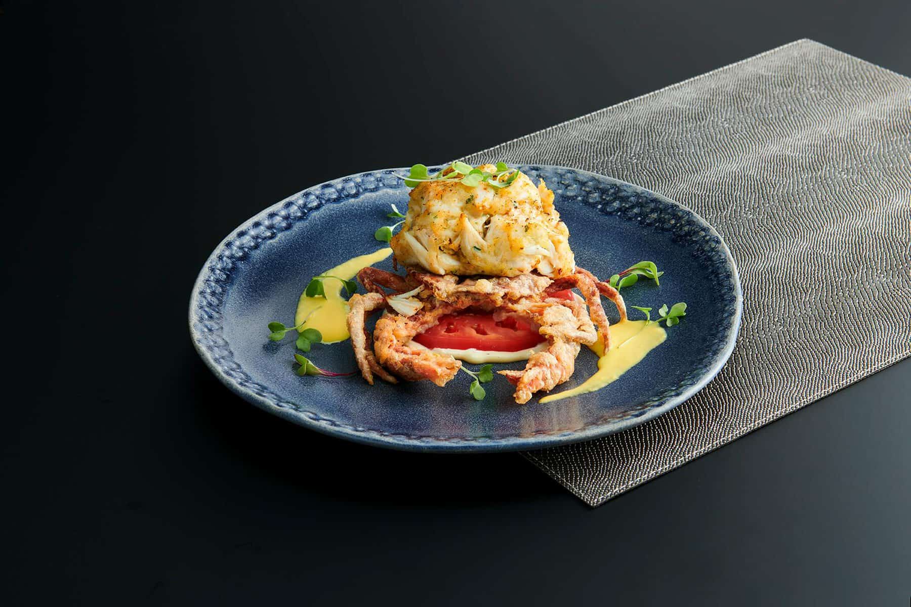 Prime crab cake entree plated at Chart House in San Antonio