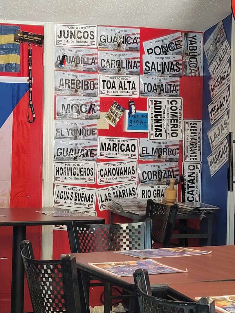 Wall painted with Puerto Rican town names inside Tex-Chick in Houston