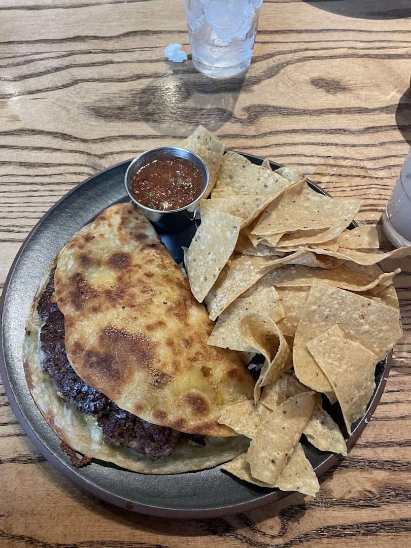 Quesadilla burger with tortilla chips and salsa at Cafe Homestead in Waco, Texas