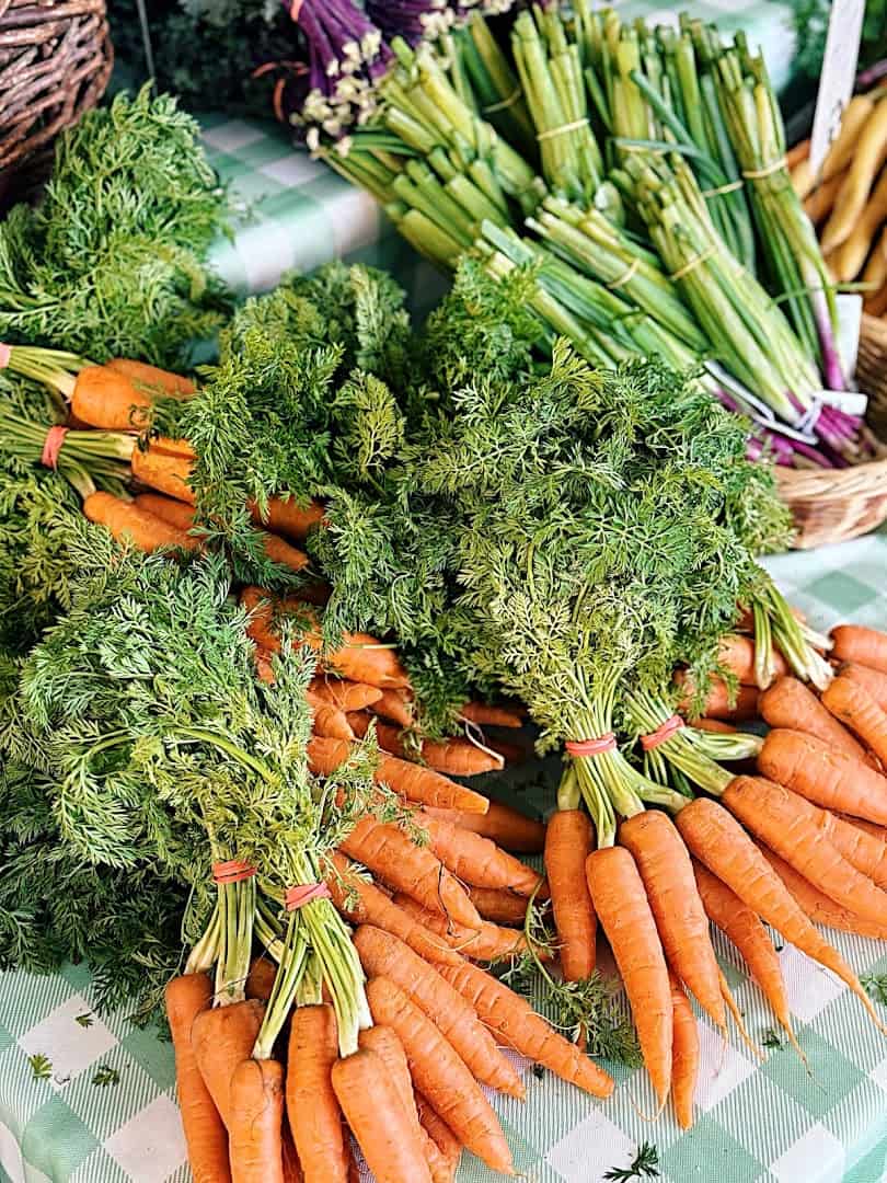 Bunches of fresh rainbow carrots at the Dallas Farmers Market