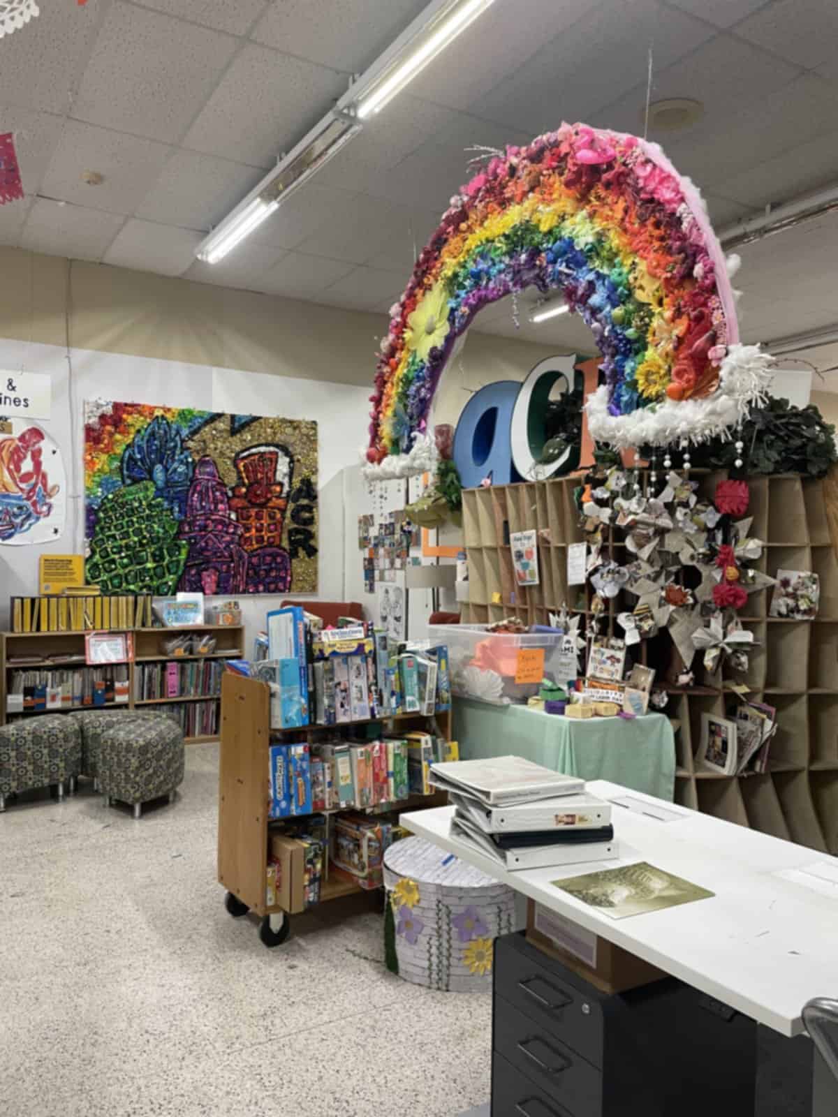 Shelves of books, games and reclaimed supplies inside Austin Creative Reuse