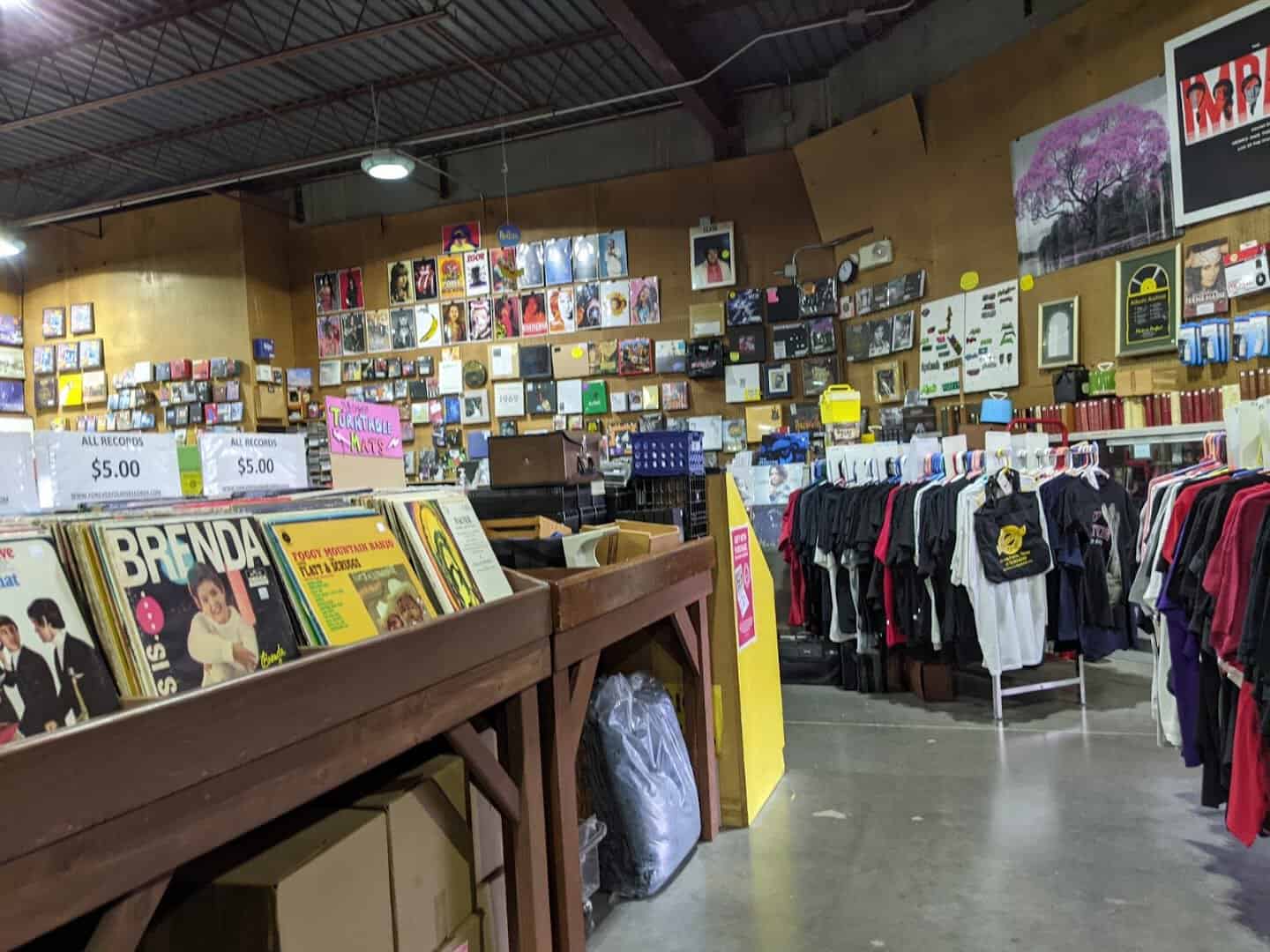 Records and band t-shirts on display at Forever Young Records in Grand Prairie, Texas