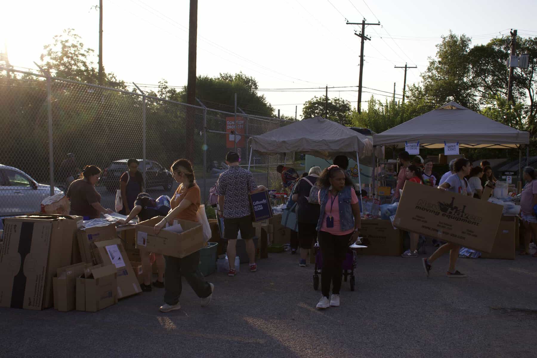 Shoppers at an outdoor reuse market hosted by Austin Creative Reuse