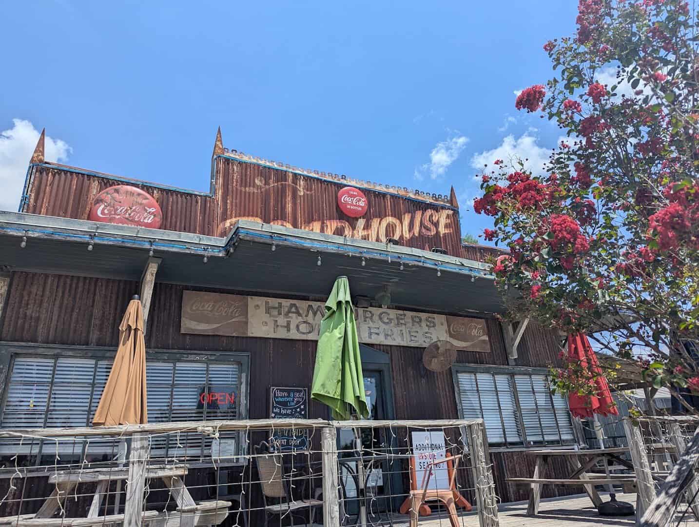 The Roadhouse restaurant storefront and sign on Highway 21 in Bastrop, Texas