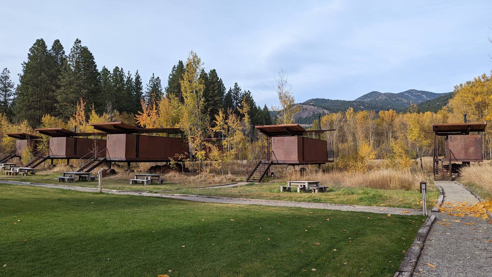 Row of Rolling Huts on a meadow below the mountains near Winthrop, Washington