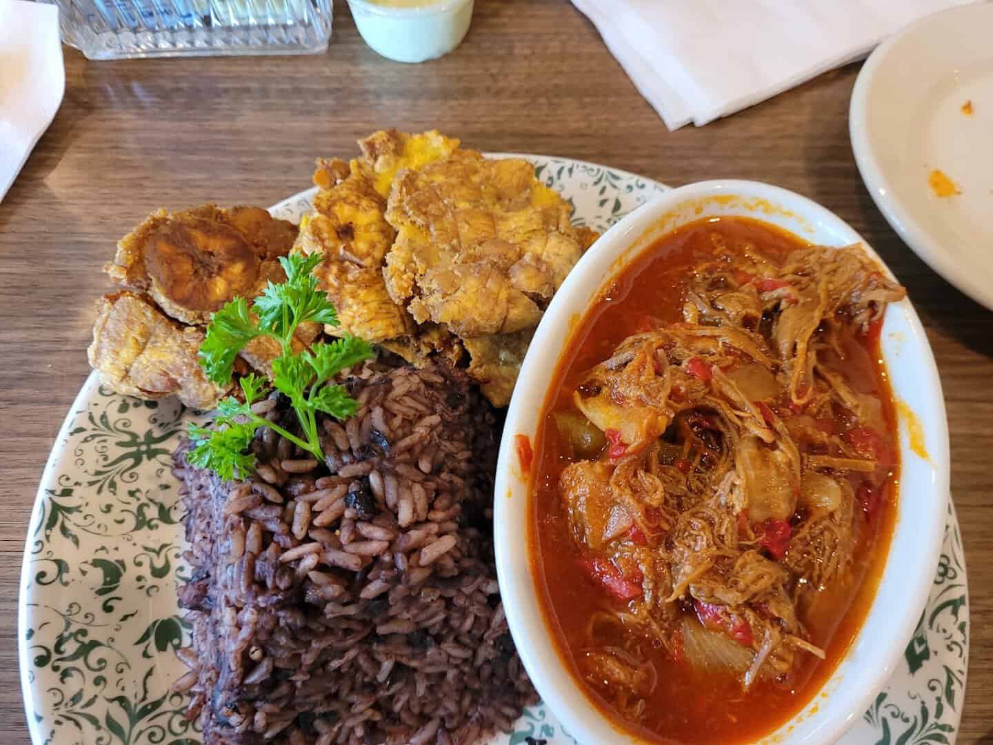 Ropa vieja, Cuban shredded beef in tomato sofrito, with rice and beans at Cafe Piquet in Bellaire, Texas
