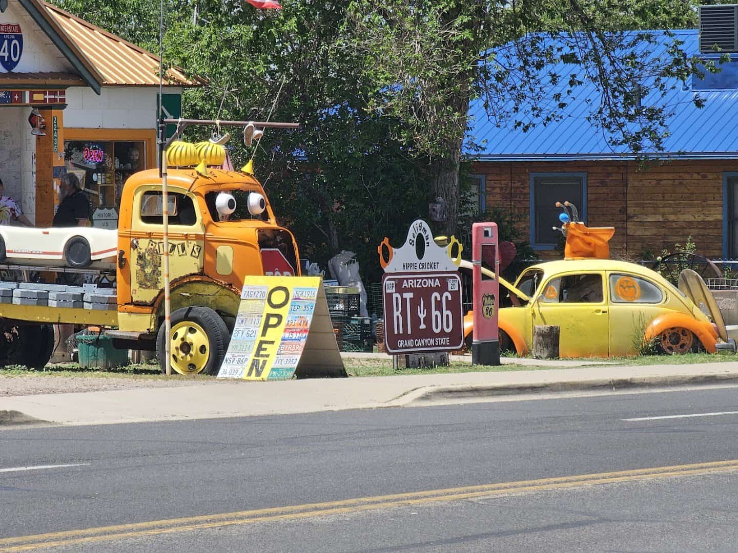 Vintage Route 66 roadside signs and cars in Seligman, Arizona