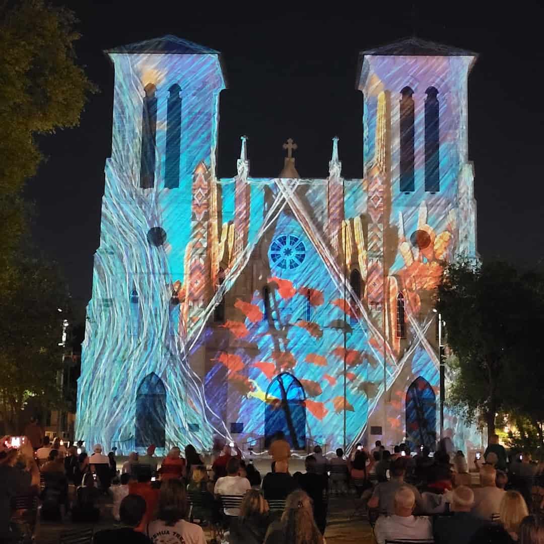 Crowd watching the Saga light show at San Fernando Cathedral in Main Plaza San Antonio