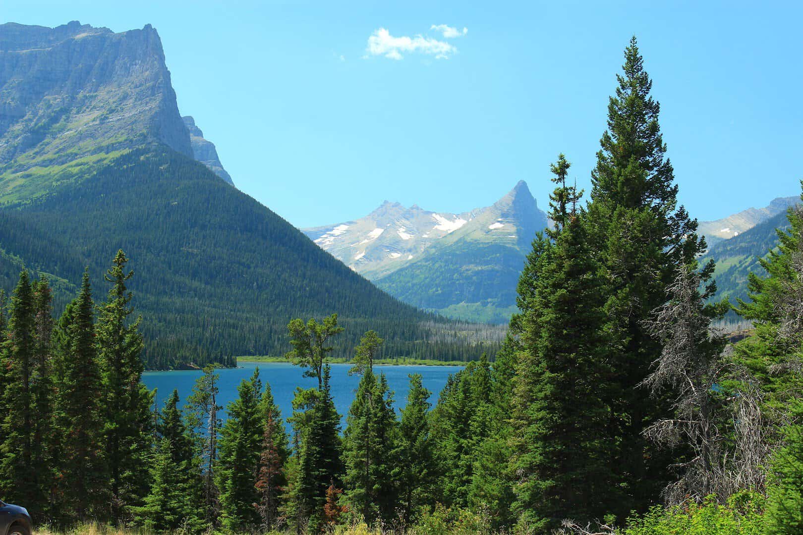 Saint Mary Lake and Wild Goose Island framed by peaks on the Going-to-the-Sun Road in Glacier National Park, Montana