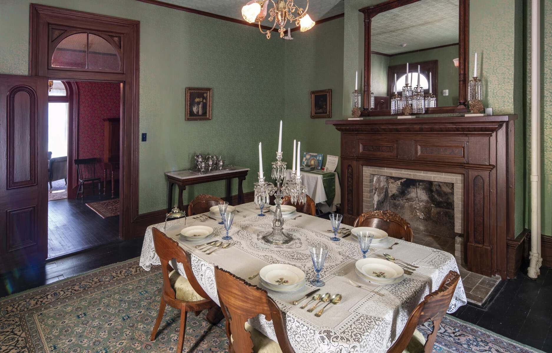 The antique-filled dining room of the Sam Bell Maxey House in Paris, Texas