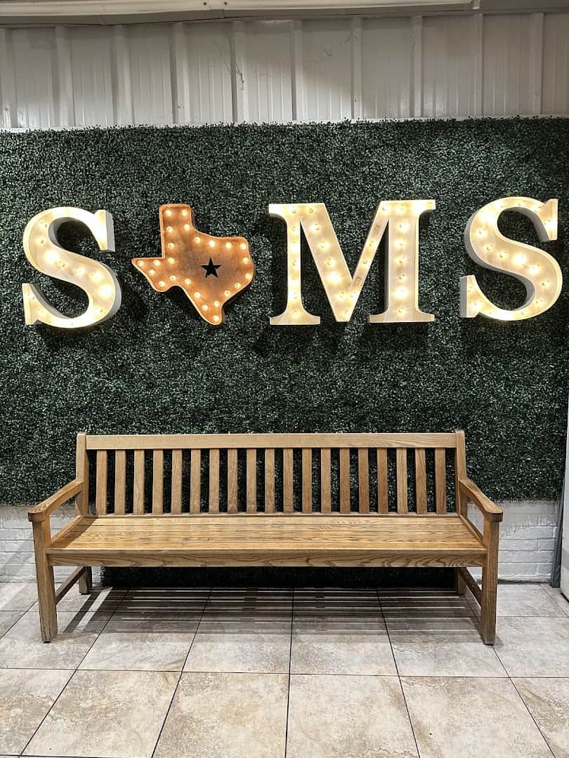 The Sam's sign and bench inside Sam's Original Restaurant in Fairfield, Texas