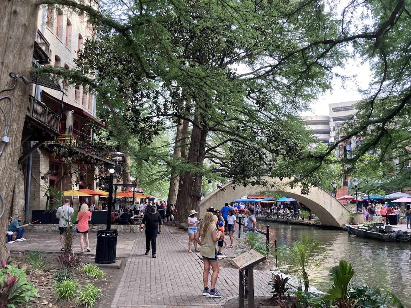 Arched stone bridge over the San Antonio River Walk in Texas