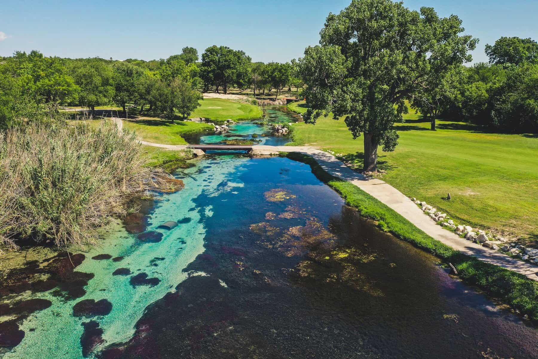 The clear turquoise water of San Felipe Creek in Del Rio, Texas