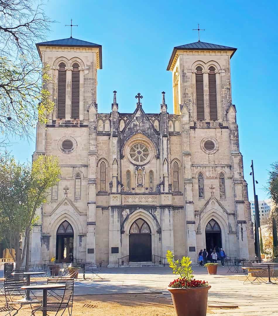 Gothic Revival twin-tower facade of San Fernando Cathedral in San Antonio by day