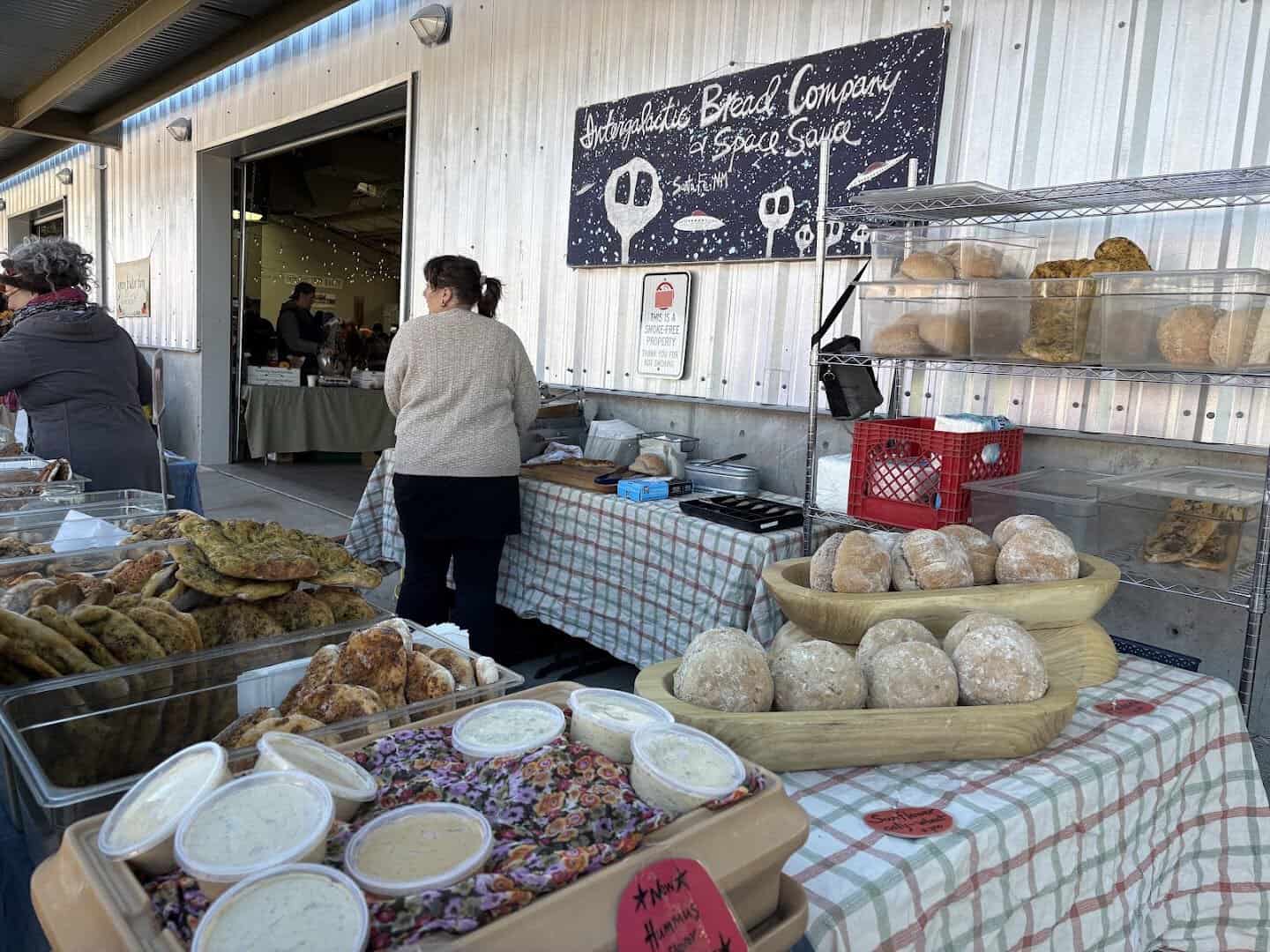 A bread and baked goods vendor stall at the Santa Fe Farmers Market in New Mexico