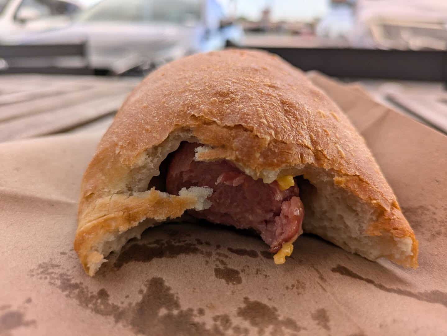 A sausage klobasnik split open at The Original Kolache Shoppe in Houston