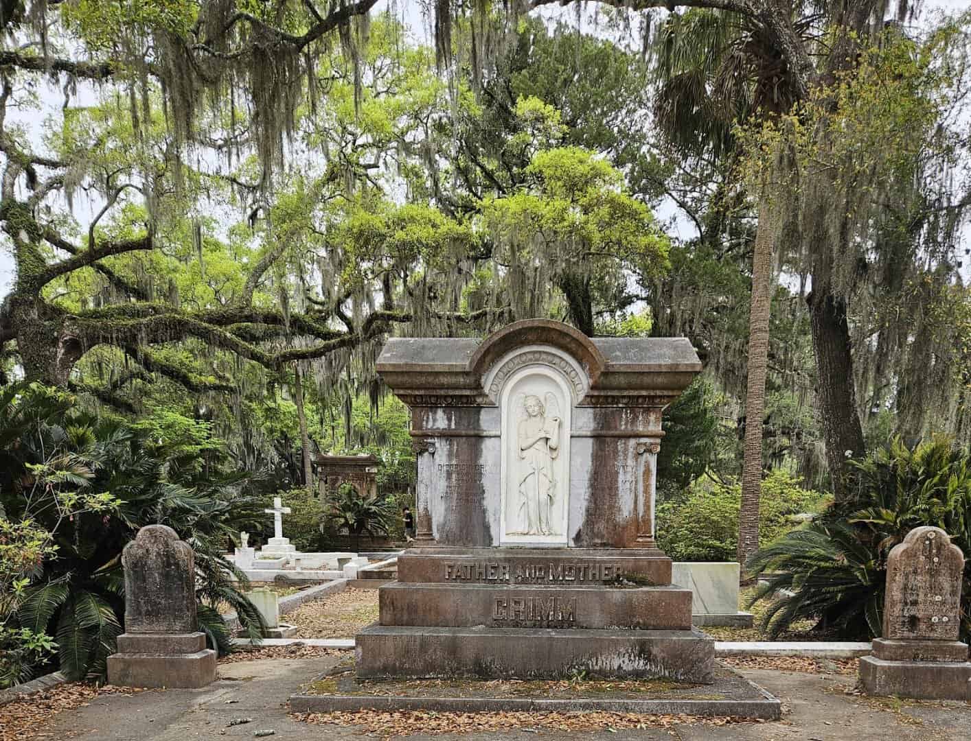 Spanish moss over a live oak and monument at Bonaventure Cemetery in Savannah, Georgia
