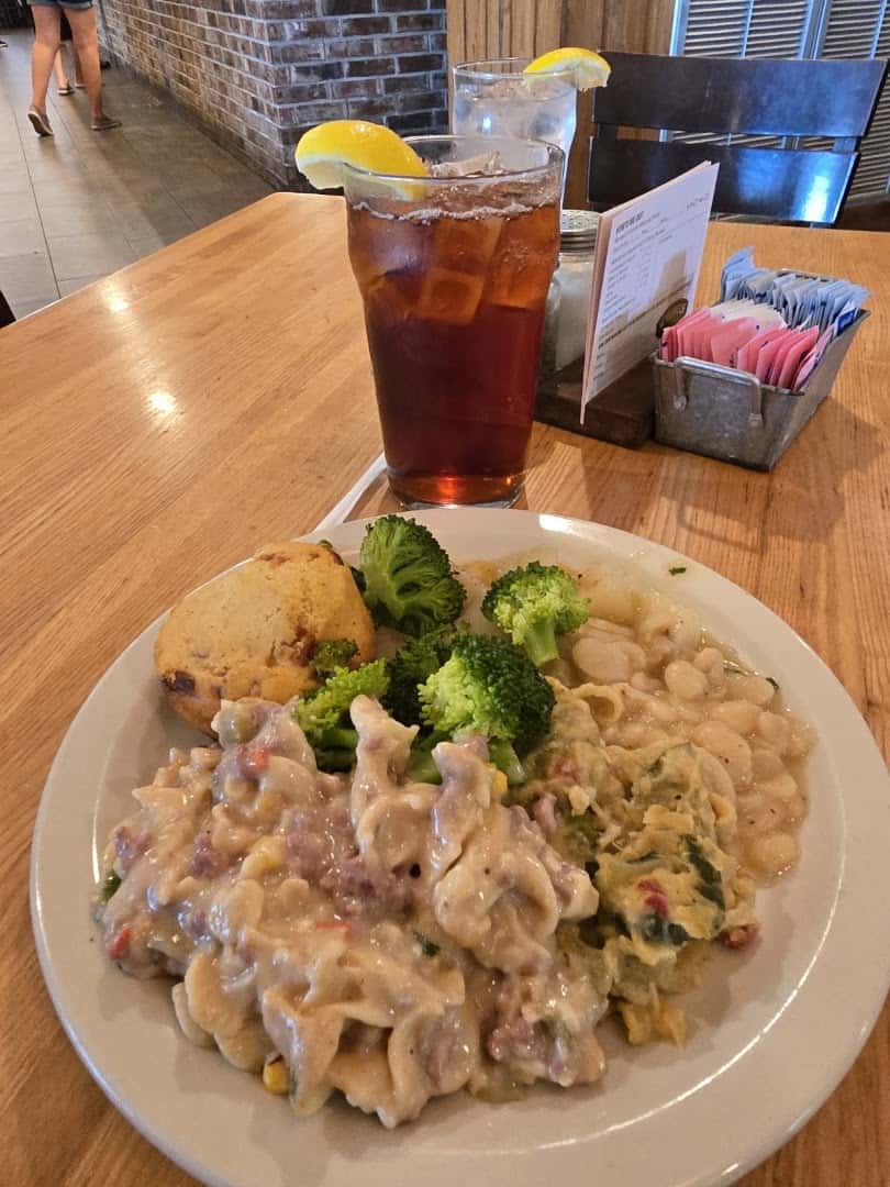 Plate of creamy comfort food with cornbread at Schobels' Restaurant in Columbus, Texas