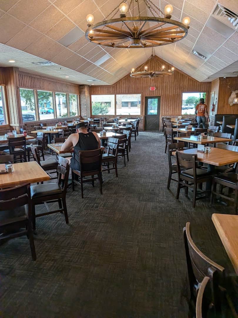 Wood-paneled dining room at Schobels' Restaurant in Columbus, Texas