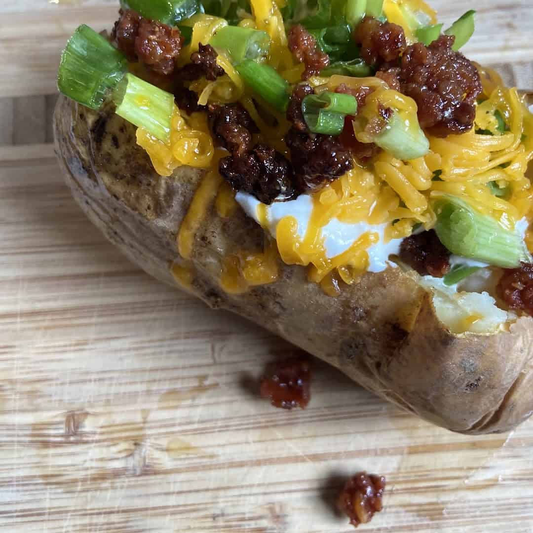 Loaded baked potato with cheddar, sour cream and bacon at Schobels' Restaurant in Columbus, Texas